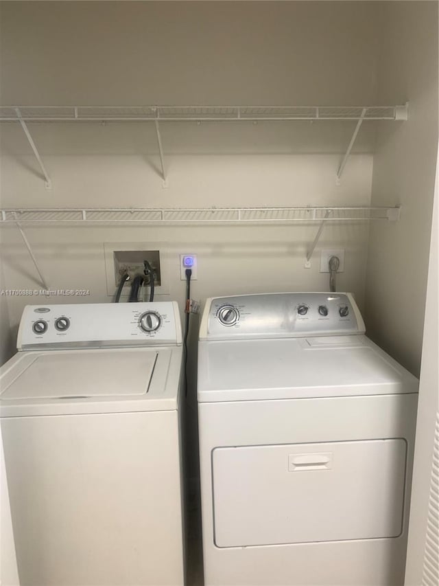 washroom featuring independent washer and dryer