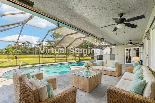 view of pool featuring an outdoor living space, a patio, ceiling fan, and a lanai