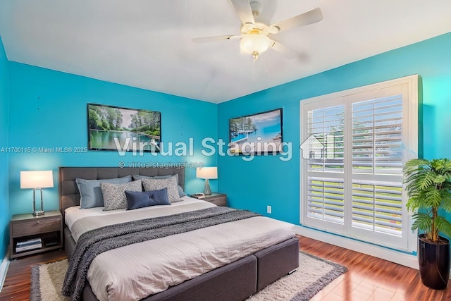 bedroom featuring wood-type flooring and ceiling fan