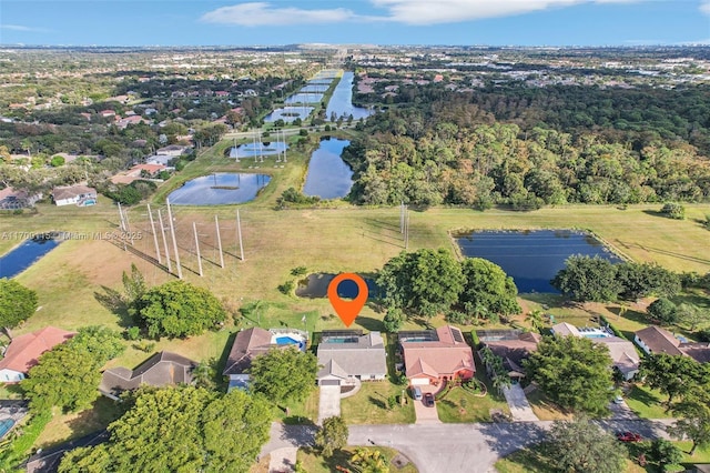 birds eye view of property featuring a water view