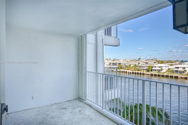 balcony featuring a water view