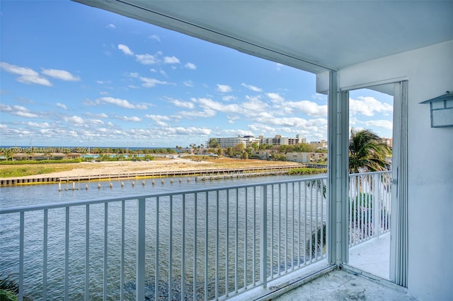 balcony featuring a water view