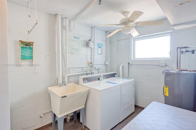 washroom featuring water heater, sink, ceiling fan, and washer and dryer