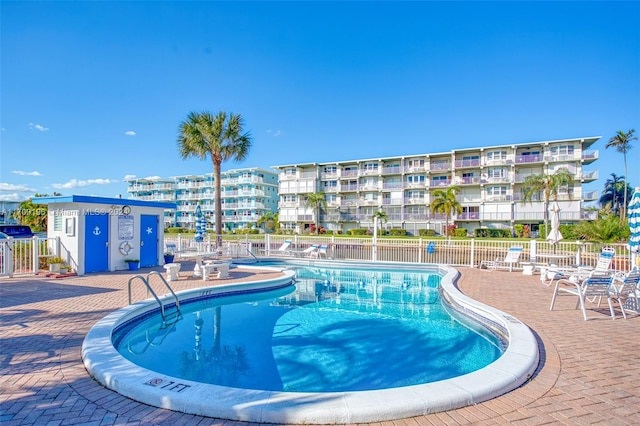 view of swimming pool with a patio