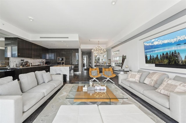 living room with an inviting chandelier