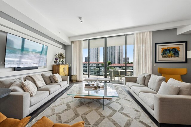 living room featuring floor to ceiling windows