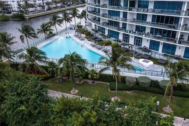 view of pool featuring a water view