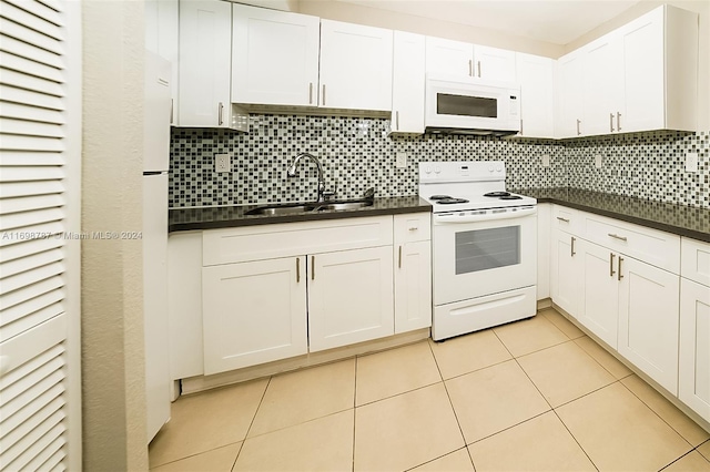 kitchen featuring white cabinets, white appliances, backsplash, and sink