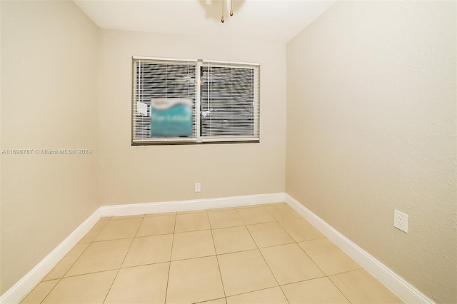 unfurnished room with light tile patterned floors