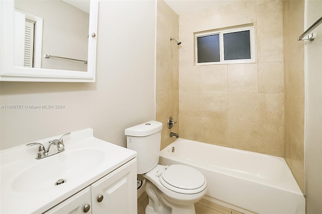 full bathroom featuring tile patterned floors, vanity, toilet, and tiled shower / bath