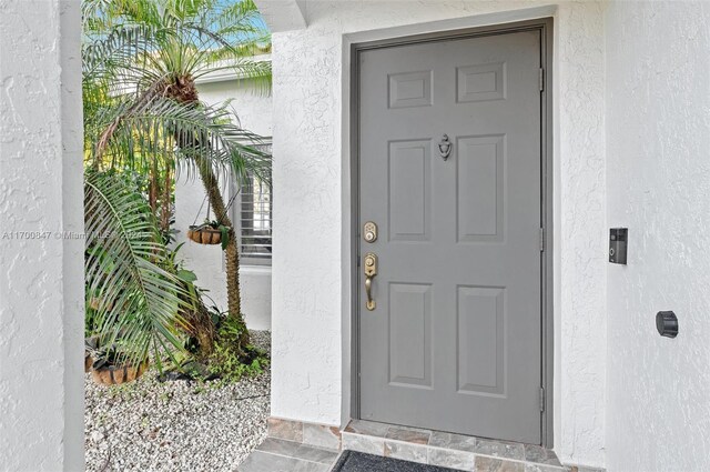 1226 SW 46th Ave, Deerfield Beach, FL 33442 - doorway to property with stucco siding