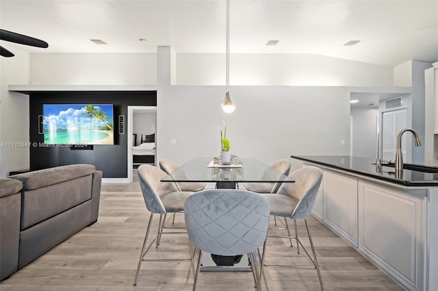 1226 SW 46th Ave, Deerfield Beach, FL 33442 - dining room featuring light wood finished floors, ceiling fan, and vaulted ceiling