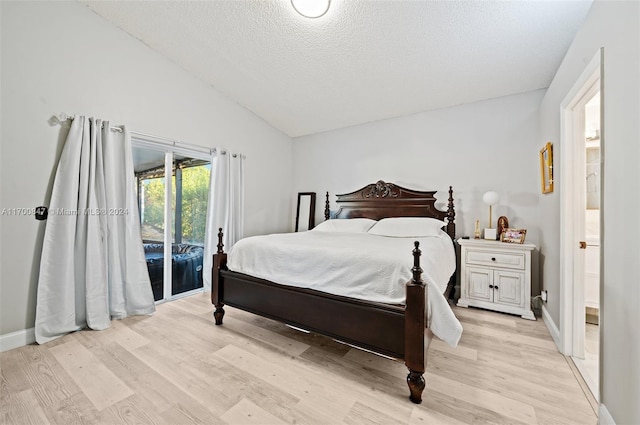 1226 SW 46th Ave, Deerfield Beach, FL 33442 - bedroom with vaulted ceiling, light wood-type flooring, access to outside, a textured ceiling, and ensuite bathroom