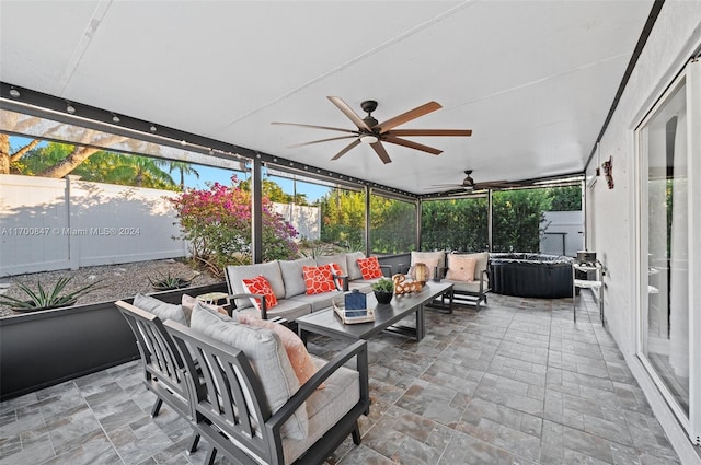 sunroom / solarium with ceiling fan