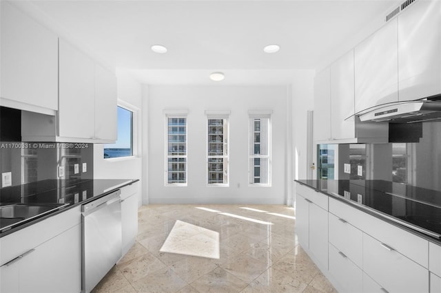 kitchen with white cabinetry, black electric stovetop, and stainless steel dishwasher