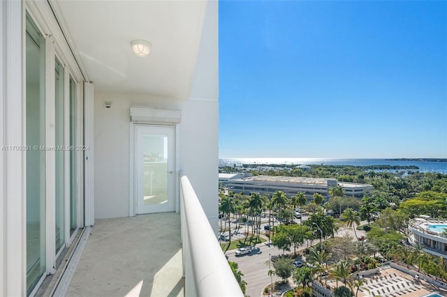 balcony featuring a water view