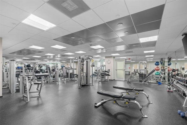 exercise room featuring a paneled ceiling