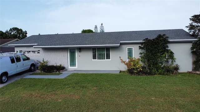 ranch-style house with a front yard