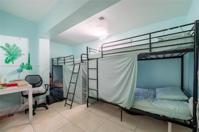 bedroom featuring light tile patterned floors