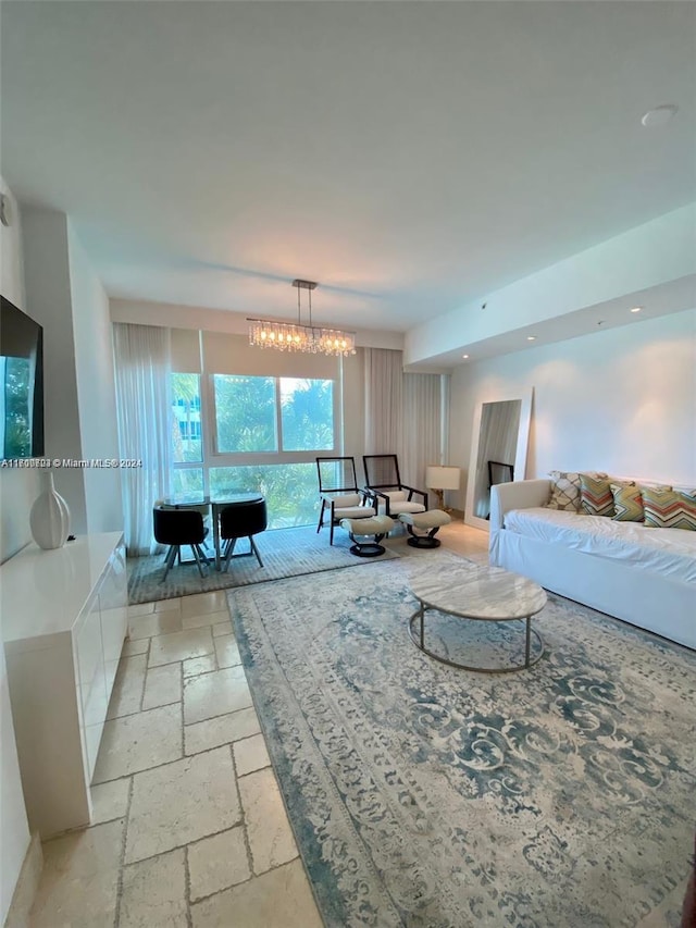 living room with a notable chandelier