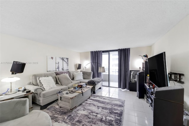 living room with light tile patterned floors and a textured ceiling