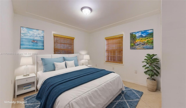 bedroom featuring light tile patterned floors