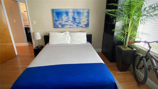 bedroom featuring hardwood / wood-style flooring