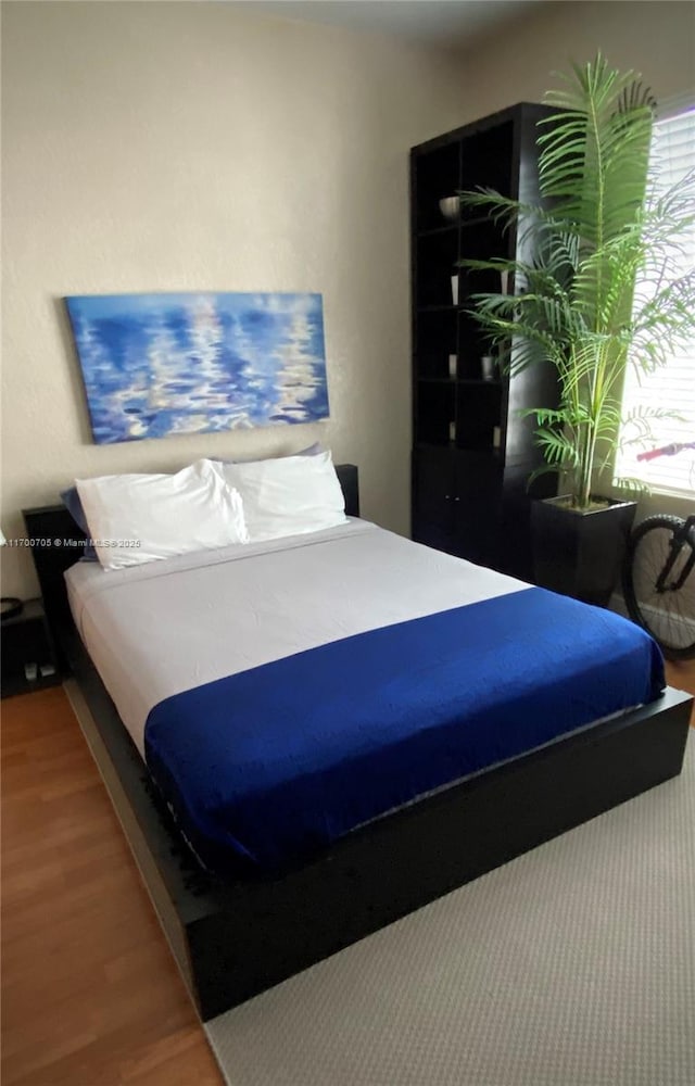 bedroom featuring hardwood / wood-style floors