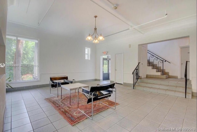 tiled living room featuring an inviting chandelier