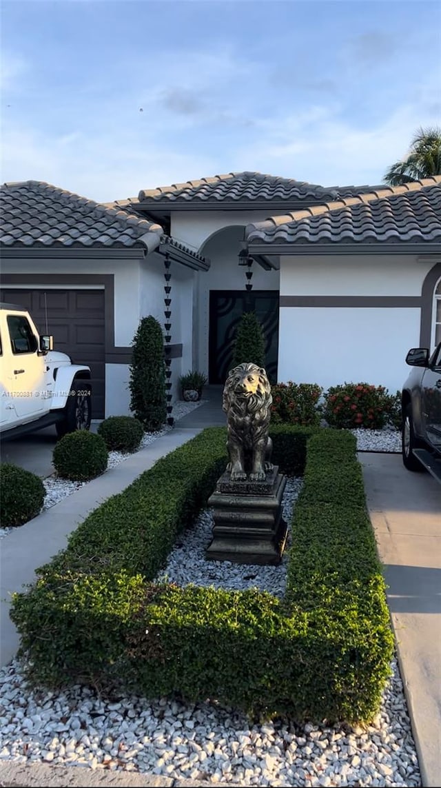 view of side of property featuring a garage