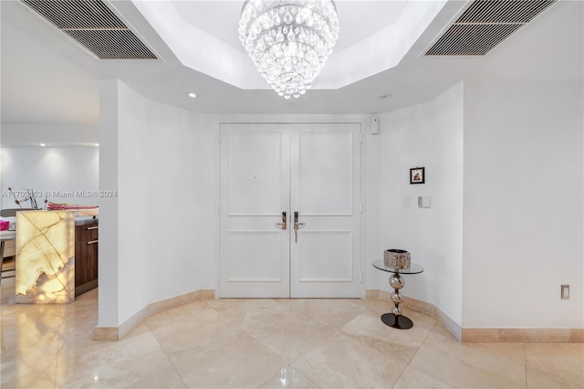 entryway featuring a chandelier