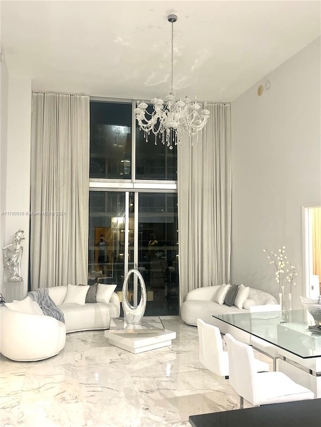 living room with an inviting chandelier