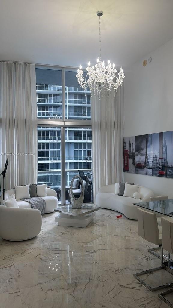 living room featuring an inviting chandelier