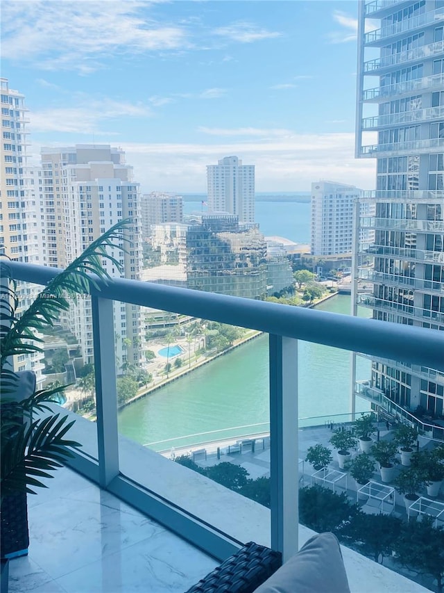 balcony featuring a water view