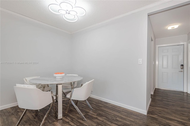 dining room with crown molding, dark hardwood / wood-style flooring, and a textured ceiling