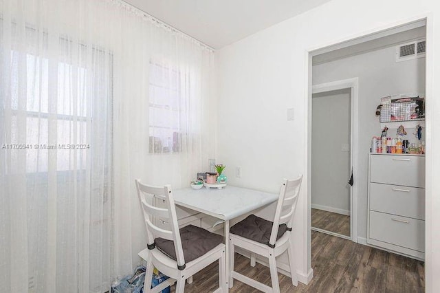 dining room with dark hardwood / wood-style flooring