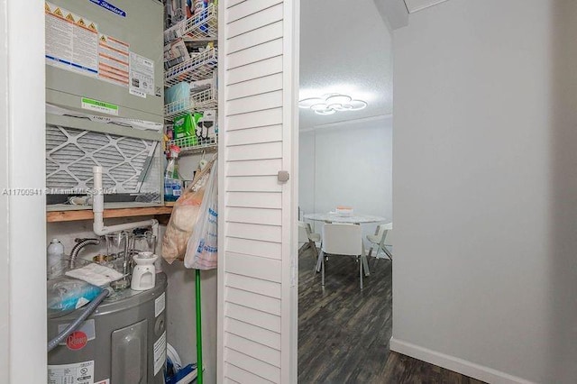 utility room featuring water heater