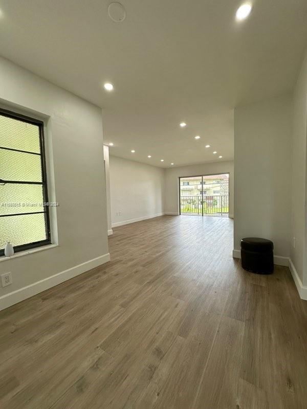 empty room featuring dark wood-type flooring