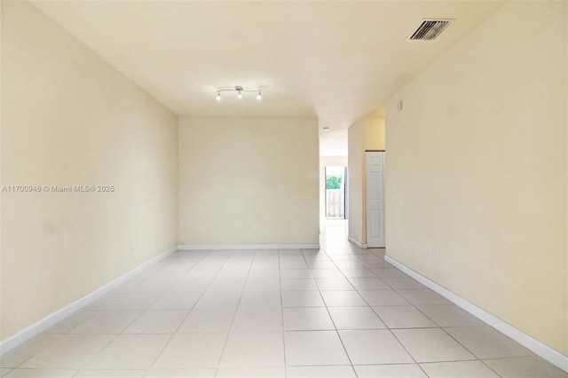 unfurnished room with light tile patterned floors