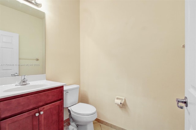 bathroom with vanity, tile patterned floors, and toilet