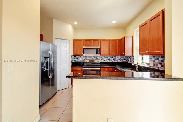 full bathroom with tile patterned floors, toilet, tiled shower / bath, and vanity