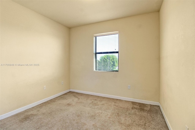 empty room featuring light colored carpet