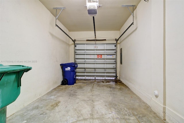 garage featuring a garage door opener and electric panel