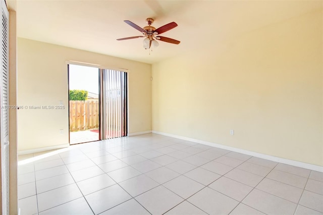 empty room featuring light tile patterned flooring and ceiling fan