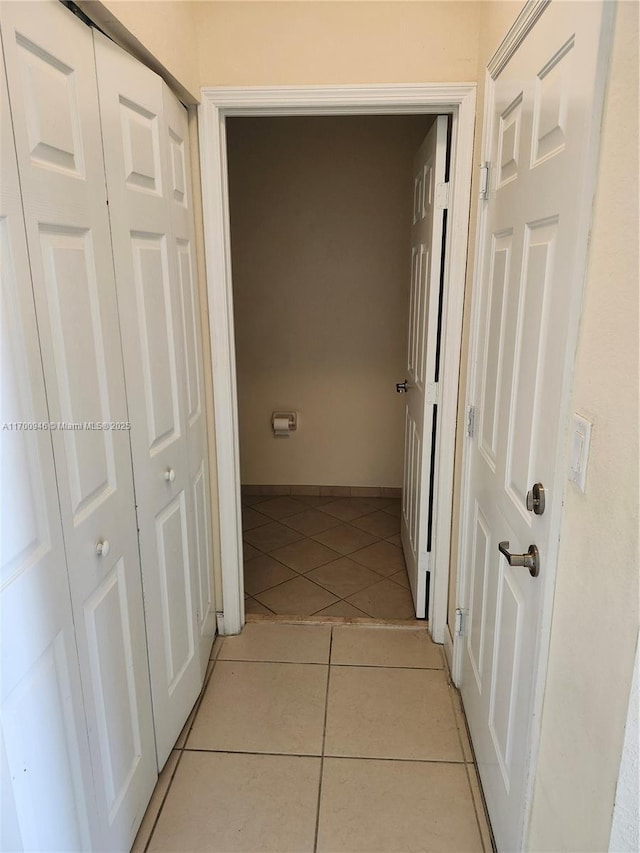 hallway with light tile patterned flooring