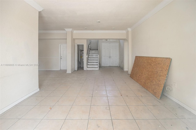 interior space featuring light tile patterned floors and ornamental molding