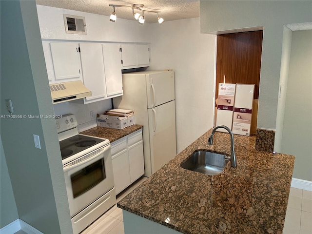 kitchen featuring a textured ceiling, white appliances, sink, white cabinets, and range hood