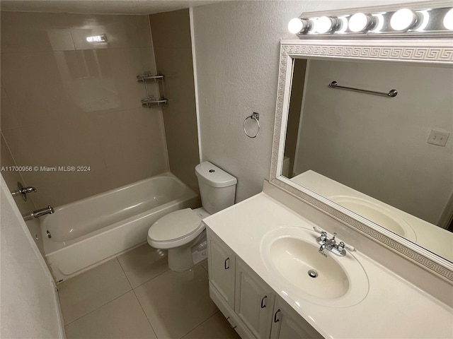 full bathroom with tile patterned flooring, vanity, toilet, and tiled shower / bath