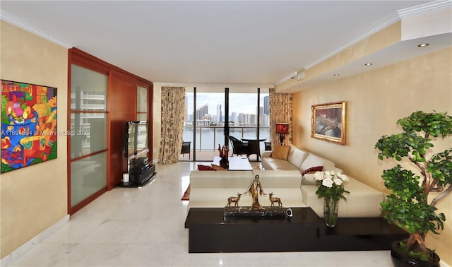 tiled living room with ornamental molding and floor to ceiling windows