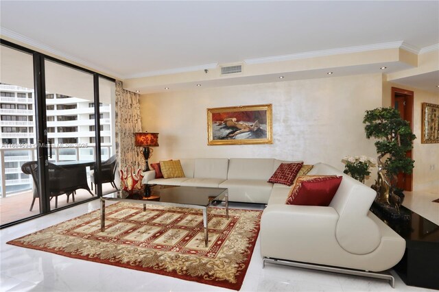 living room with ornamental molding and a wall of windows